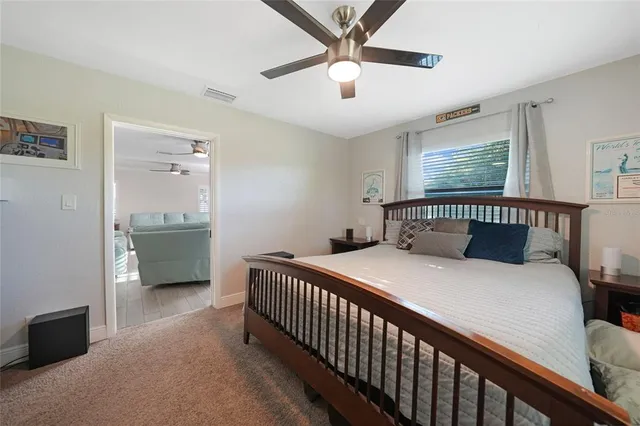 a bathroom with a sink a toilet a shower and a mirror