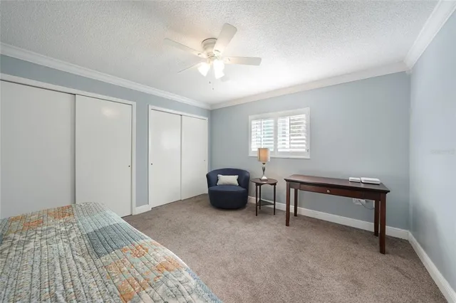 a view of a patio with table and chairs with wooden floor and fence