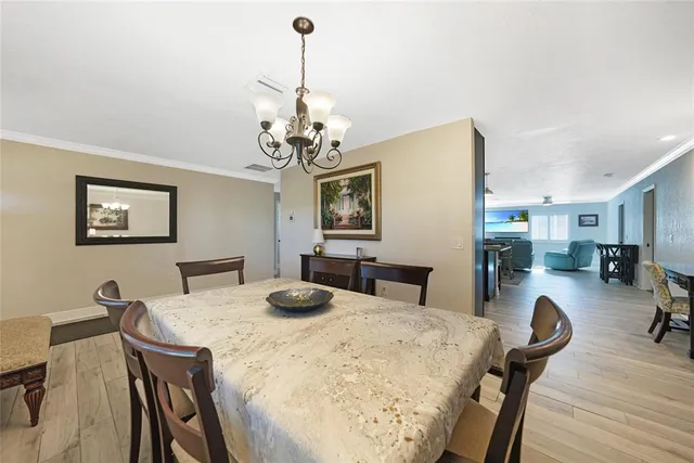 a kitchen with stainless steel appliances granite countertop a sink and a refrigerator