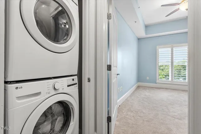 a view of a hallway with washer and dryer
