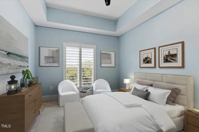 a bedroom with two beds and windows