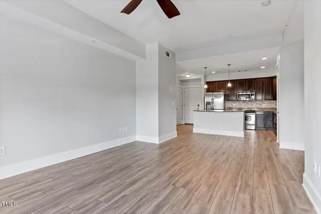 a view of kitchen and wooden floor
