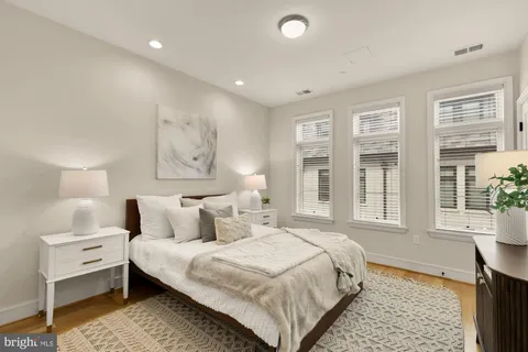 a bedroom with a large bed and a window