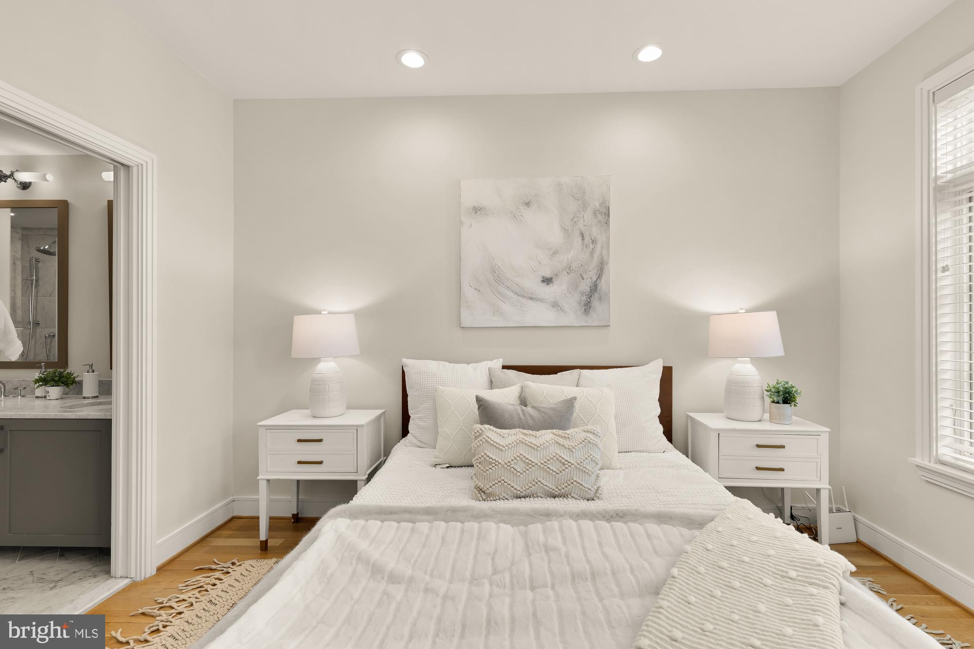 415 Guethler's Way Washington, DC 20003 - Photo 15 of 32 a bedroom with a bed and a lamp on dresser