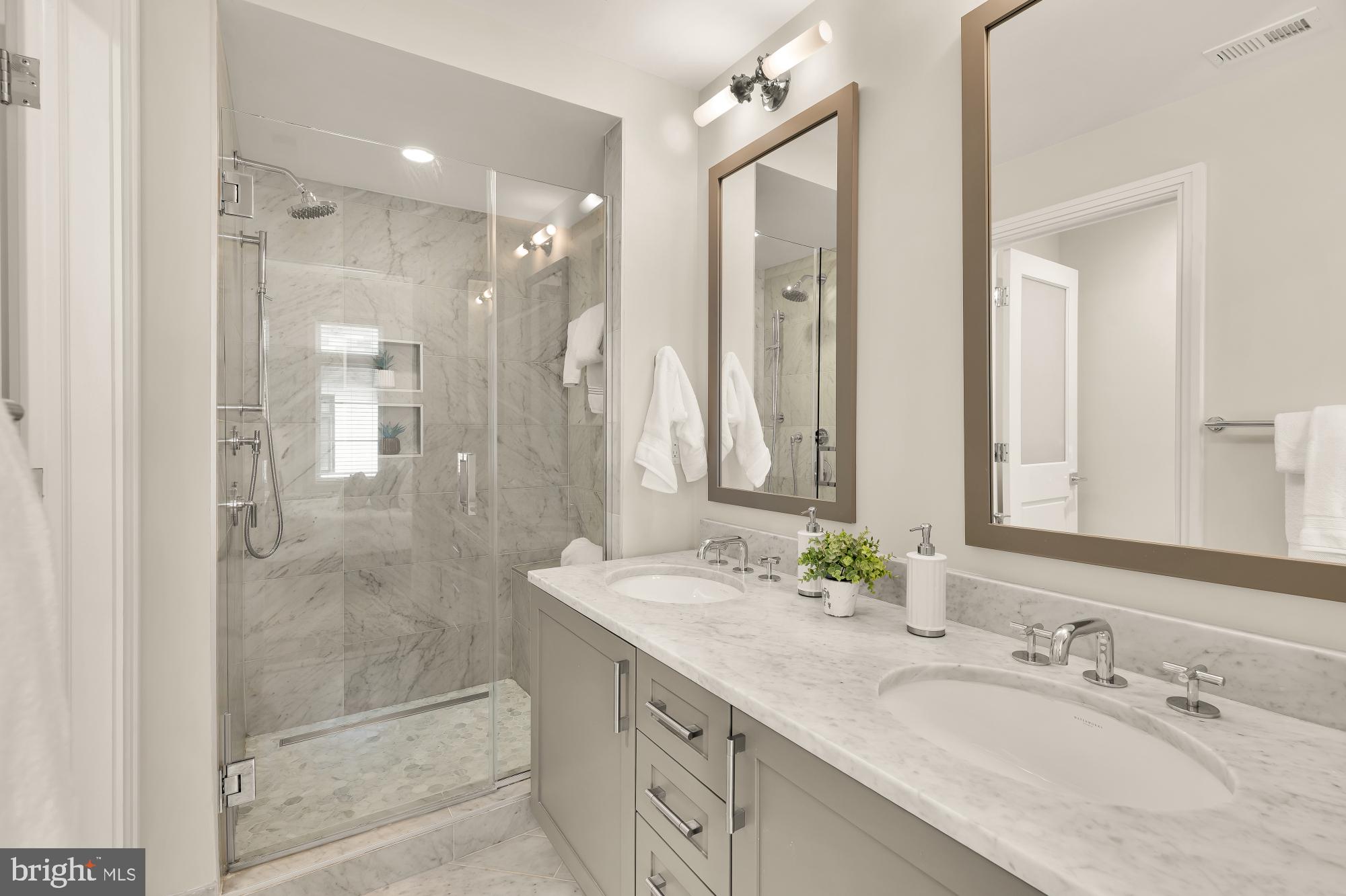 415 Guethler's Way Washington, DC 20003 - Photo 17 of 32 a bathroom with a granite countertop sink mirror and double