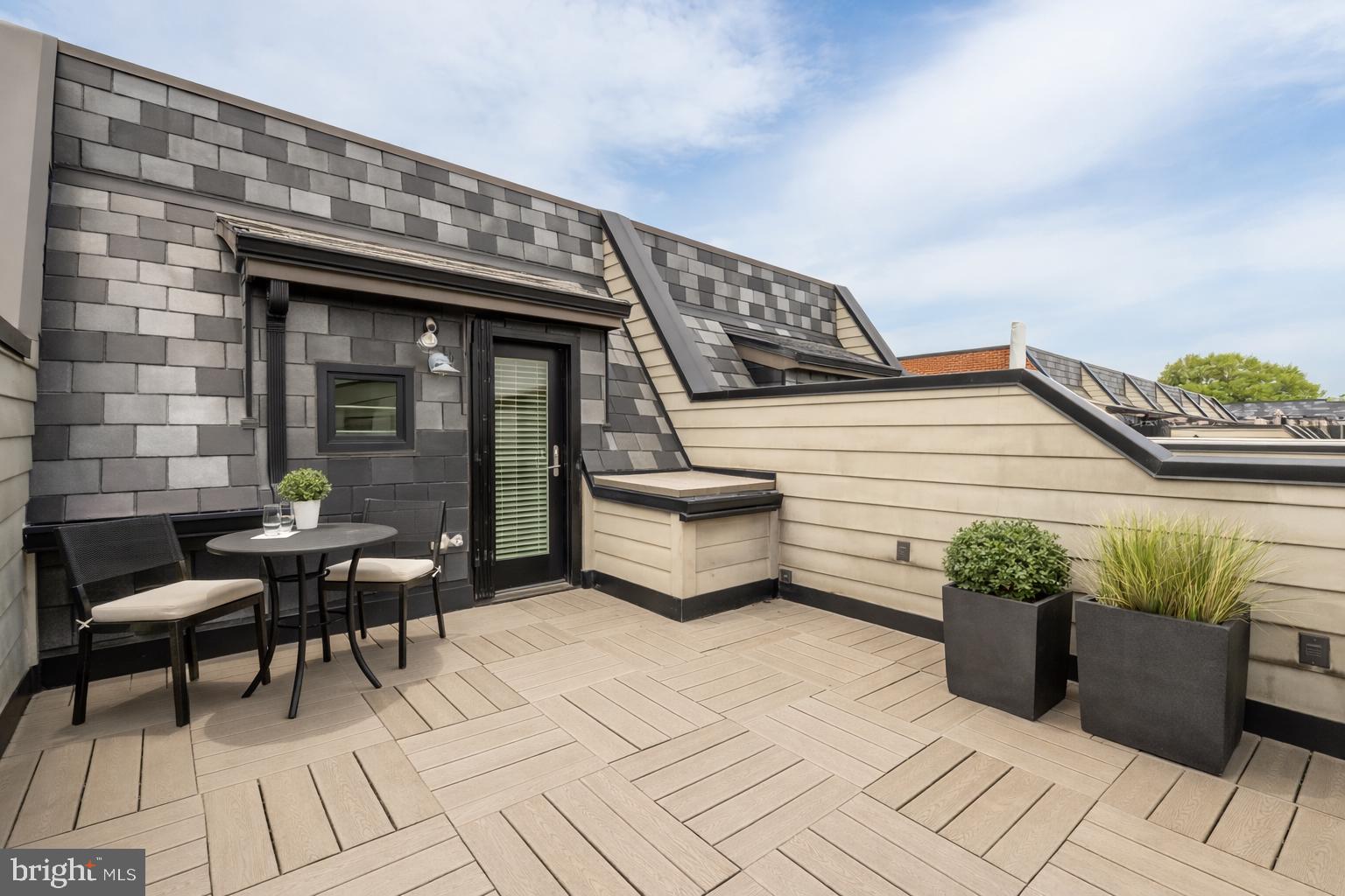 415 Guethler's Way Washington, DC 20003 - Photo 29 of 32 a roof deck with table and chairs
