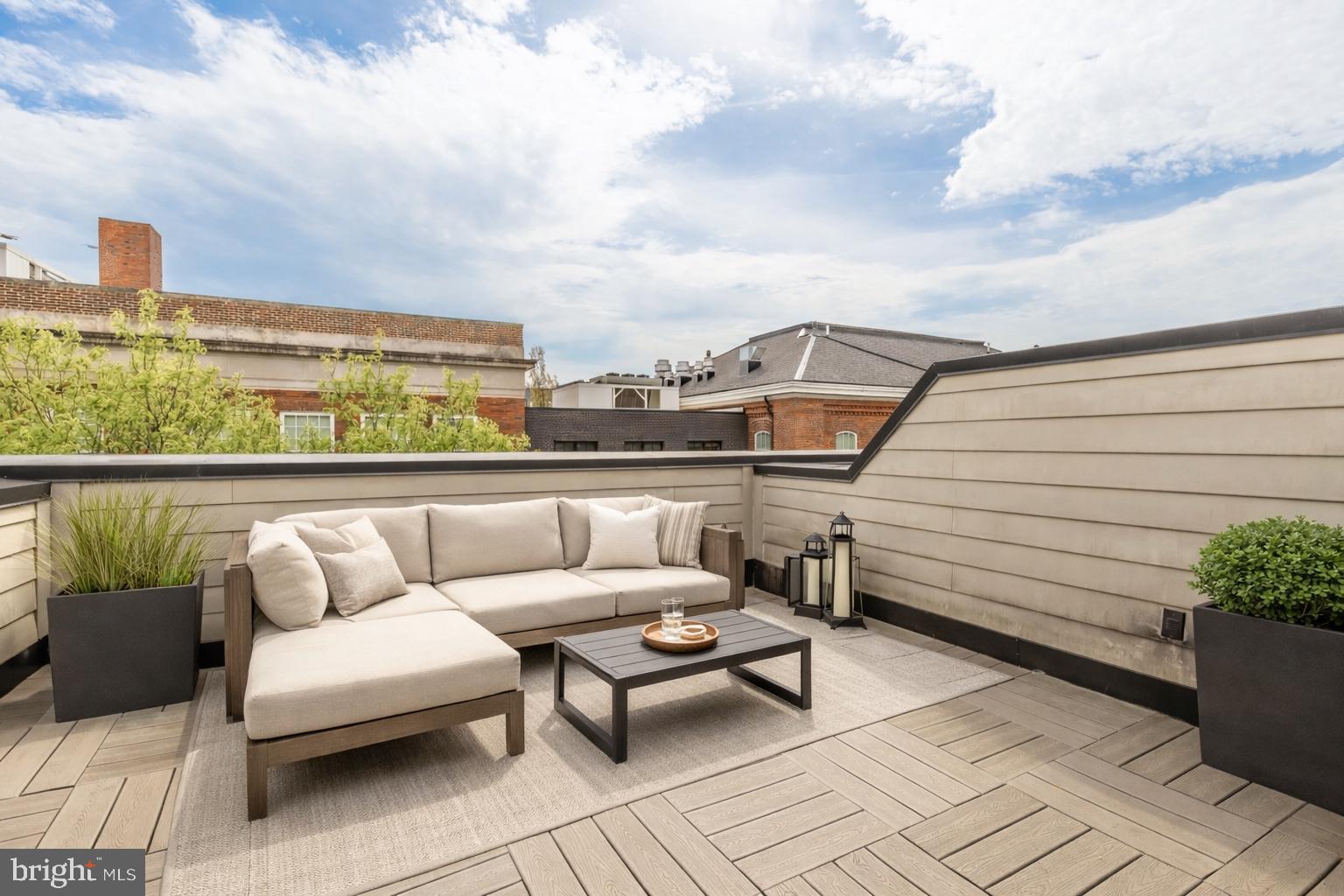 415 Guethler's Way Washington, DC 20003 - Photo 30 of 32 a view of a terrace with couches and sky view