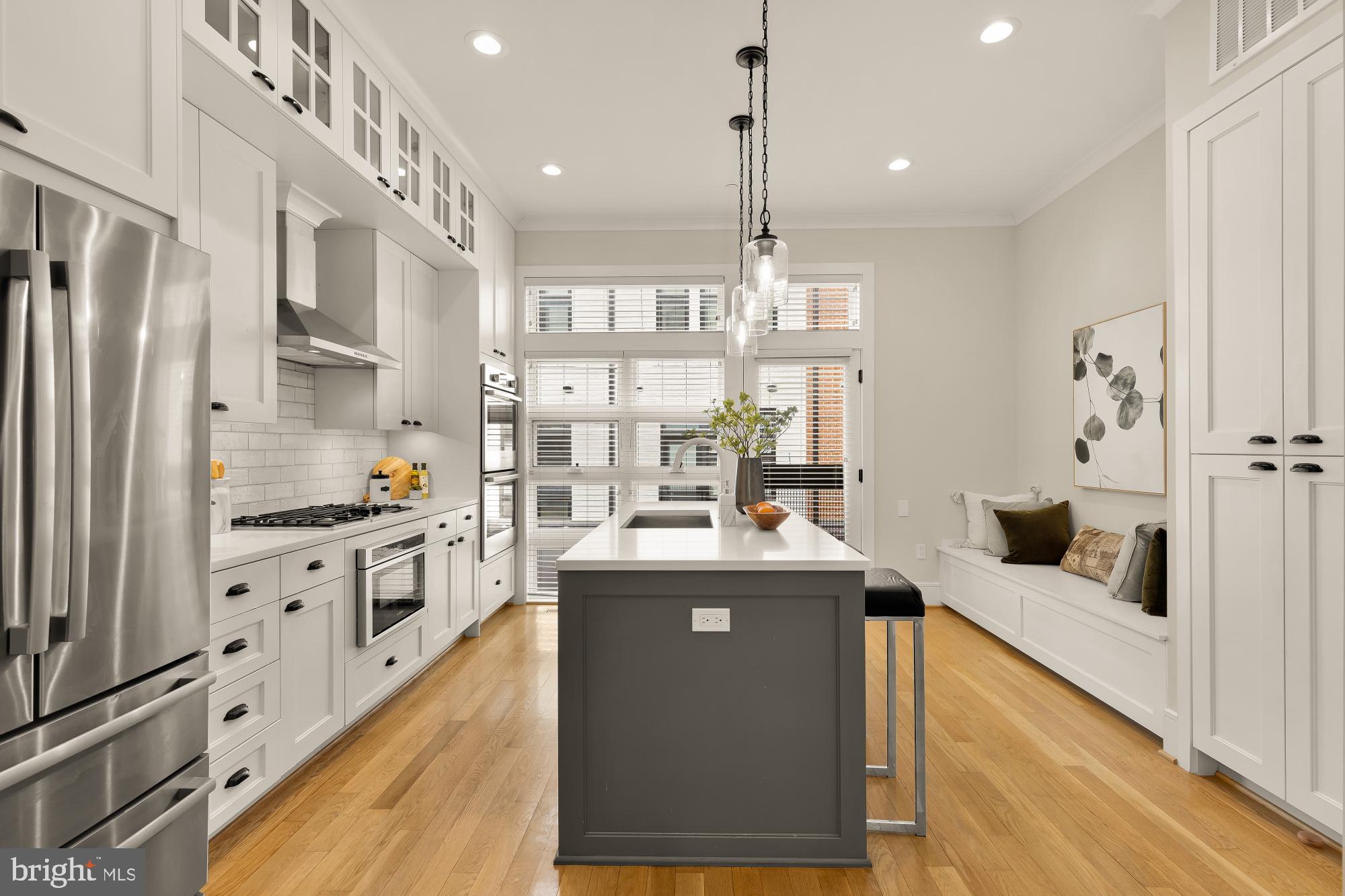 415 Guethler's Way Washington, DC 20003 - Photo 9 of 32 a kitchen with stainless steel appliances granite countertop a sink stove and refrigerator