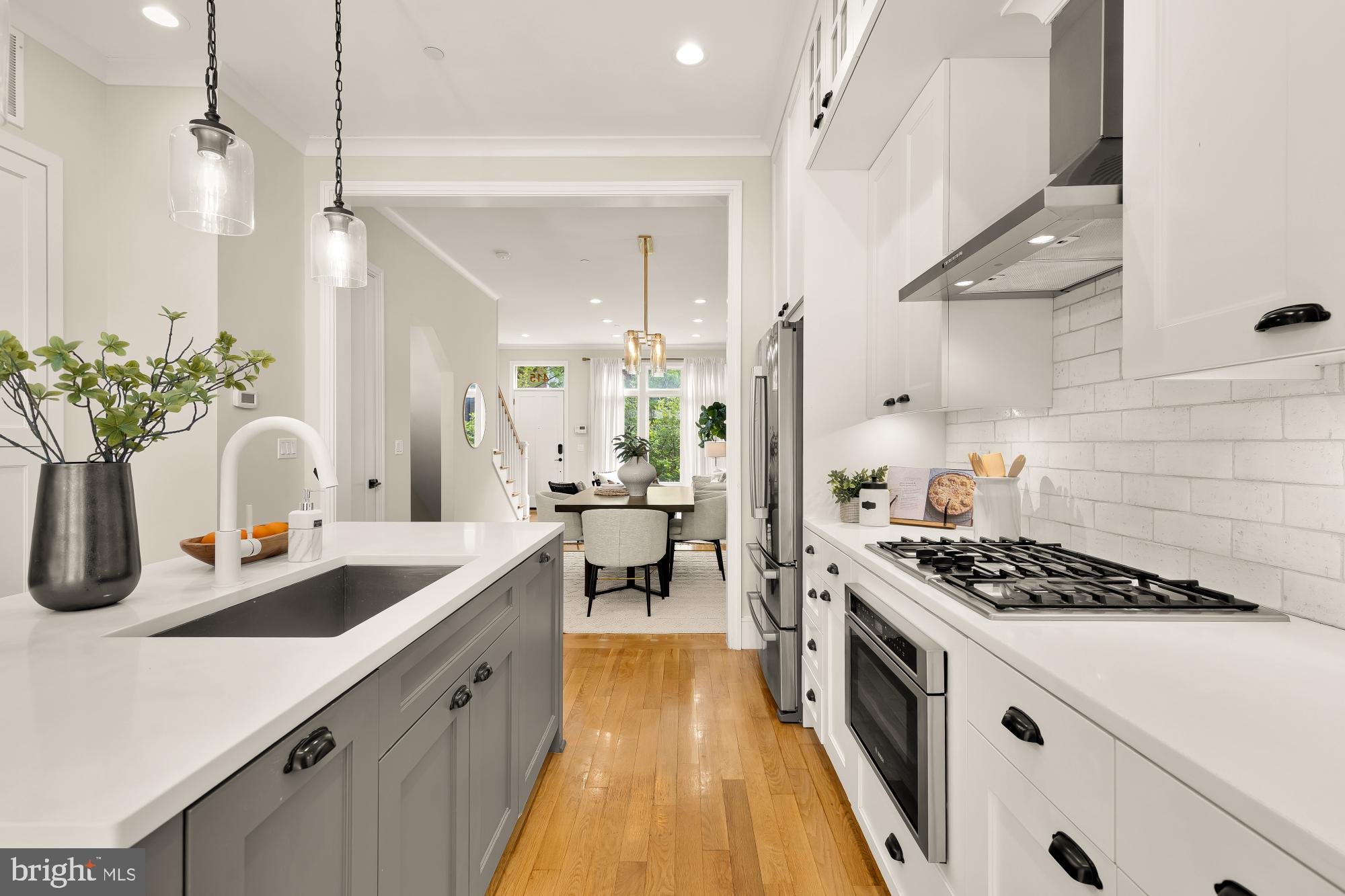 415 Guethler's Way Washington, DC 20003 - Photo 10 of 32 a kitchen with sink stove and cabinets