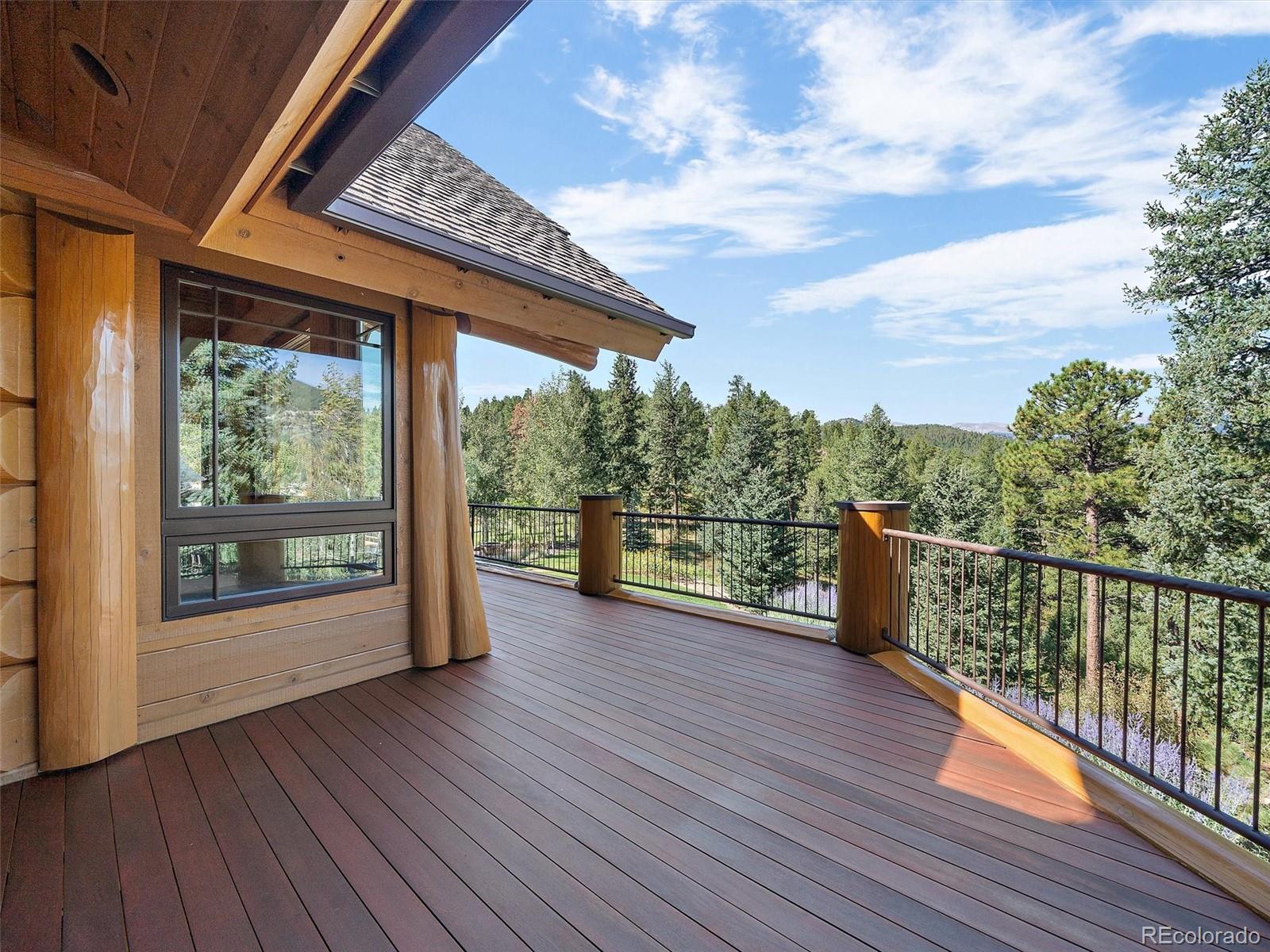 451 Bear Meadow Trail Evergreen, CO 80439 - Photo 29 of 45 a view of a balcony with lake view