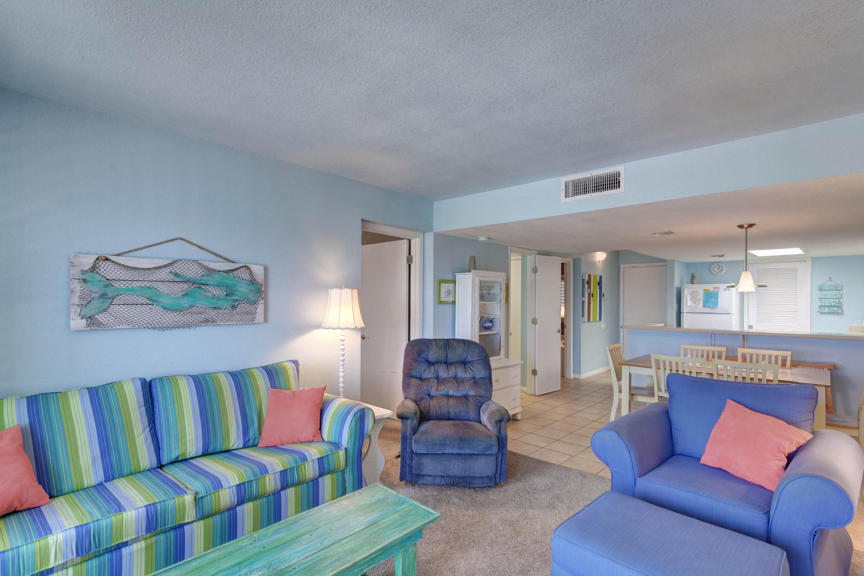 23223 Front Beach Road, Unit 701 Panama City Beach, FL 32413 - Photo 11 of 42 a living room with furniture