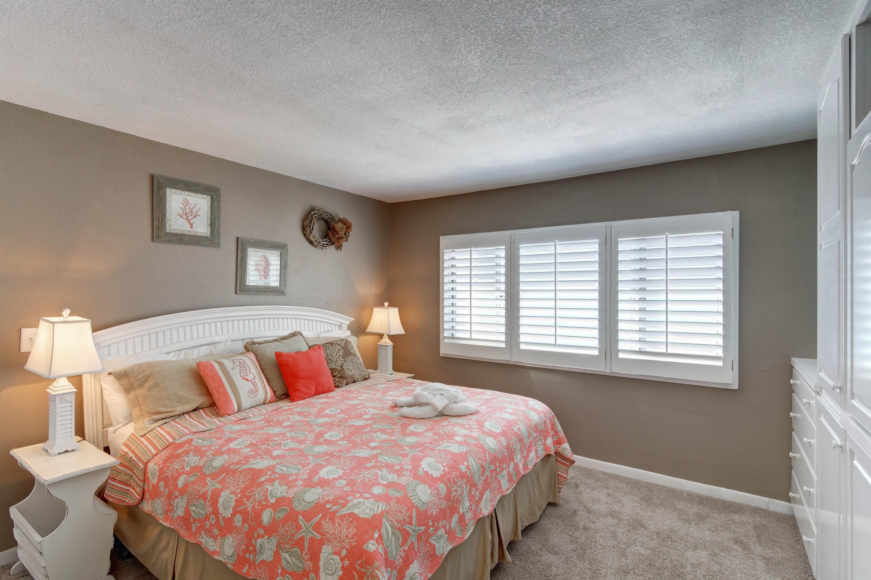 23223 Front Beach Road, Unit 701 Panama City Beach, FL 32413 - Photo 19 of 42 a bedroom with a bed and a window