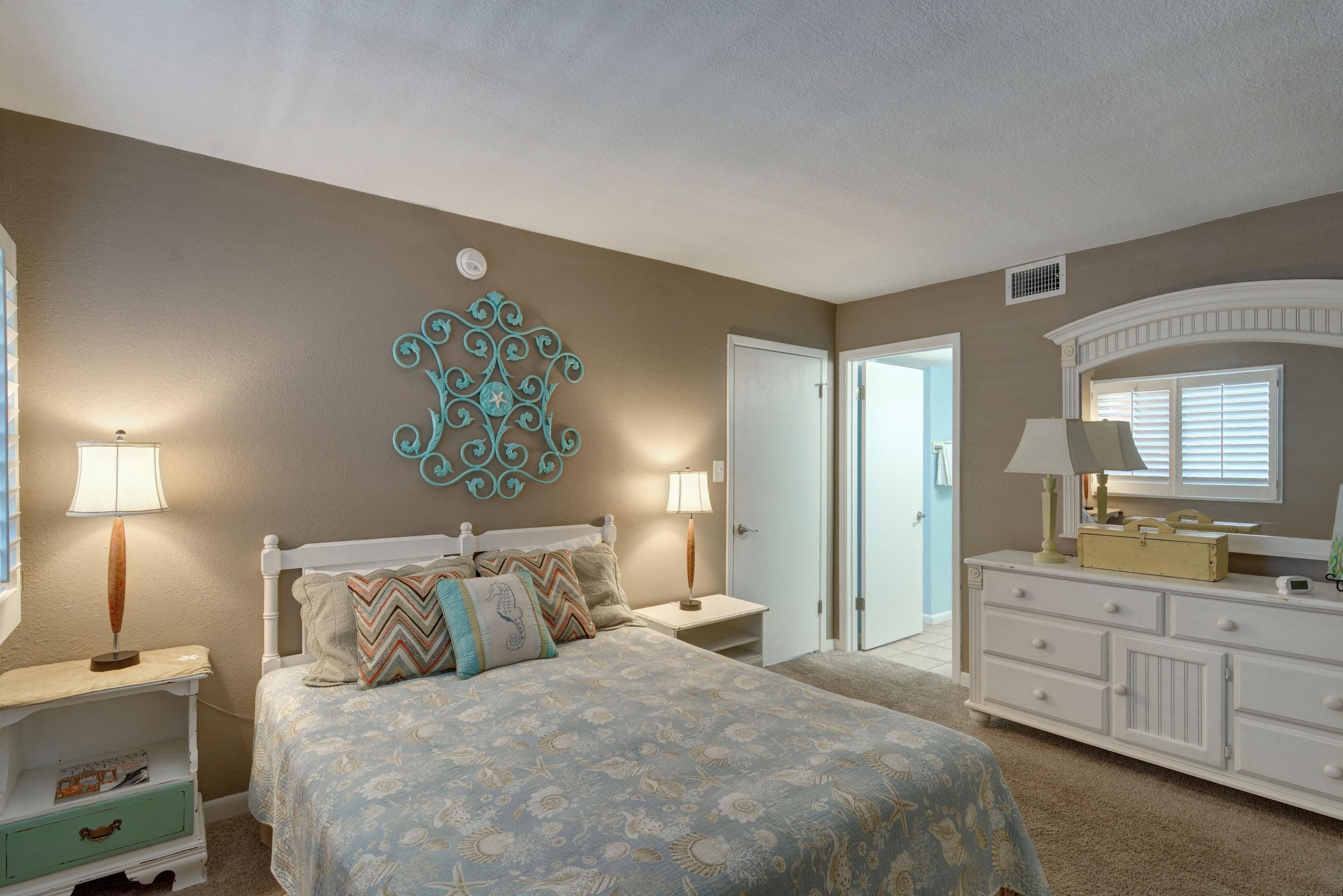 23223 Front Beach Road, Unit 701 Panama City Beach, FL 32413 - Photo 26 of 42 a bedroom with a bed and a couch