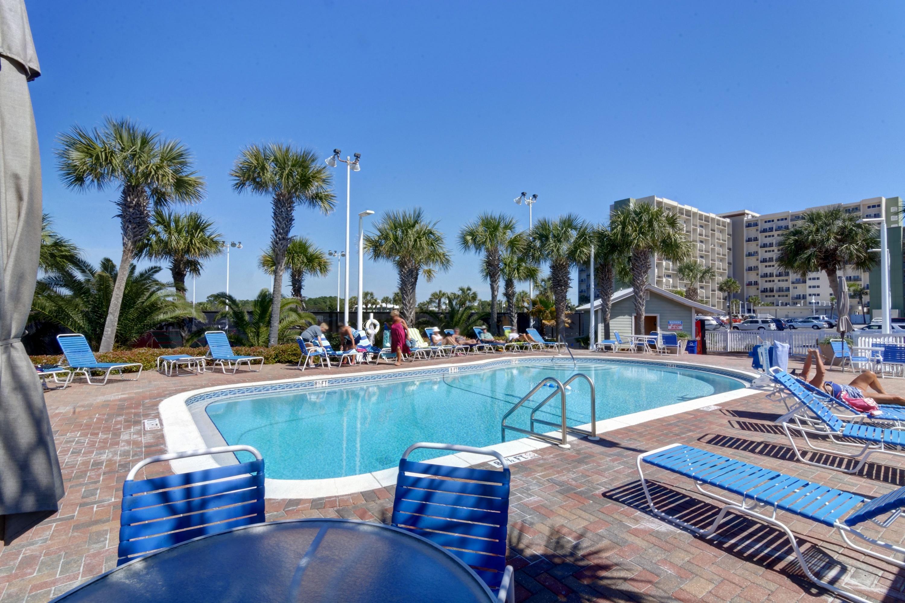 23223 Front Beach Road, Unit 701 Panama City Beach, FL 32413 - Photo 30 of 42 a view of a swimming pool with lounge chairs