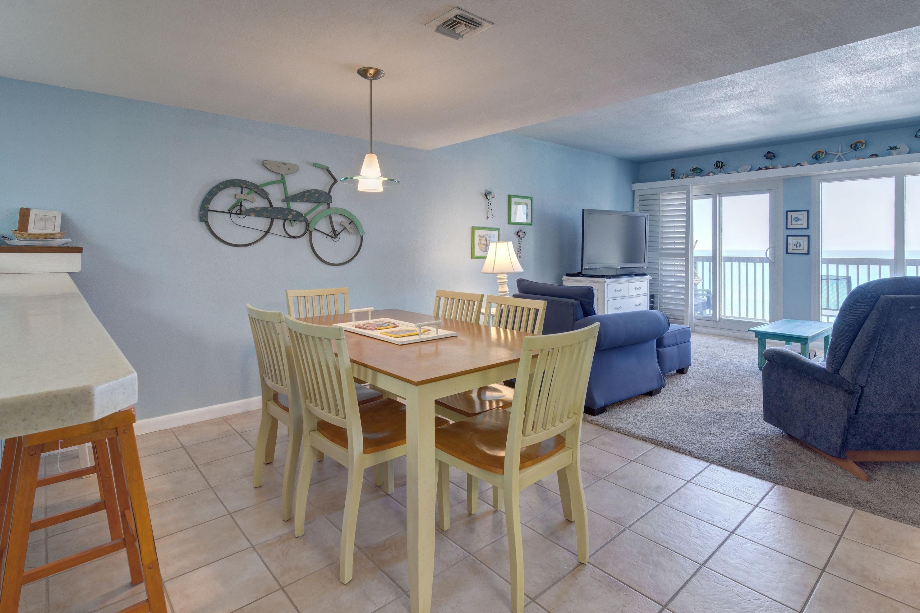 23223 Front Beach Road, Unit 701 Panama City Beach, FL 32413 - Photo 6 of 42 a view of a dining room with furniture window and wooden floor