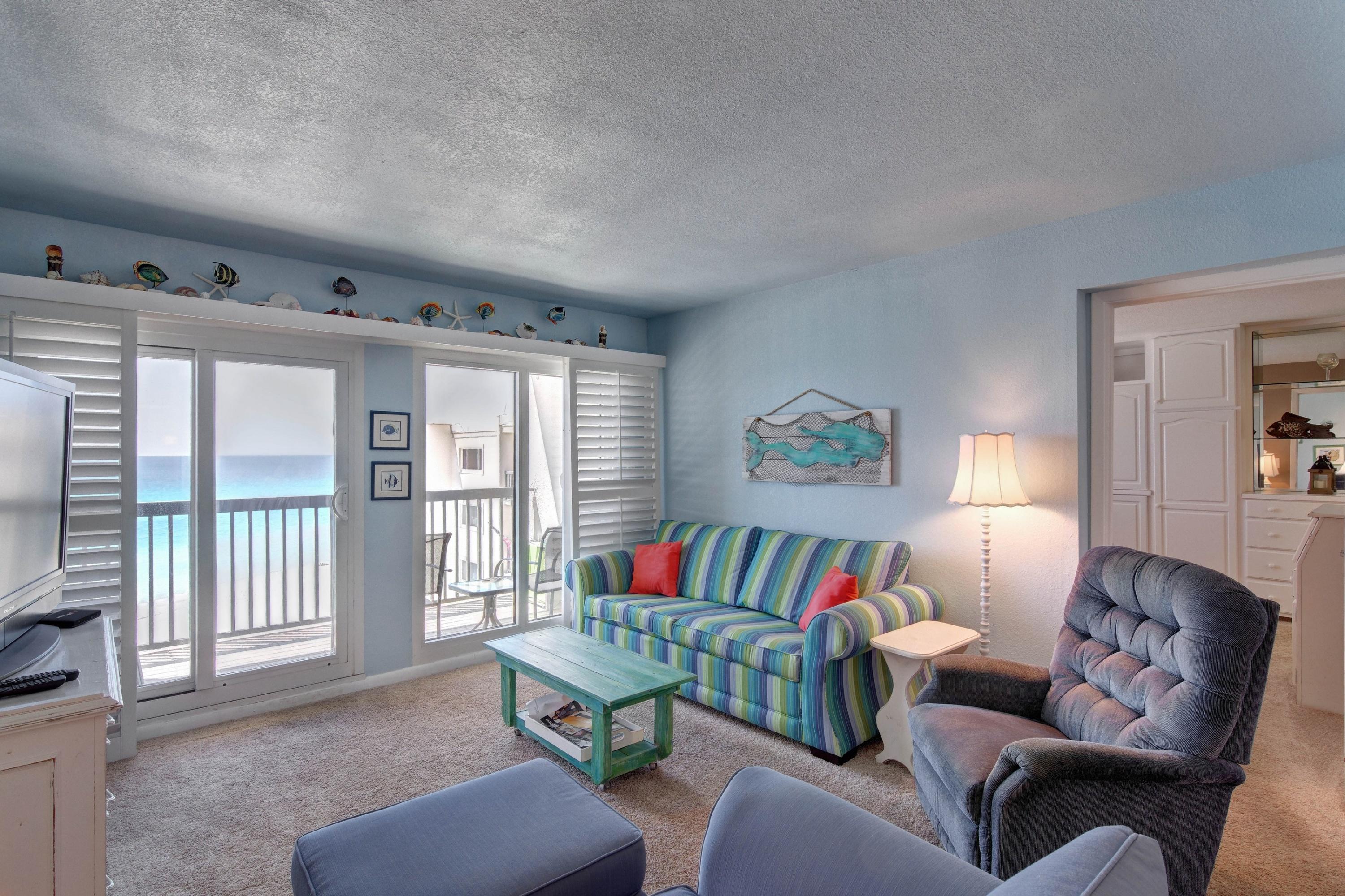 23223 Front Beach Road, Unit 701 Panama City Beach, FL 32413 - Photo 8 of 42 a living room with furniture and a large window