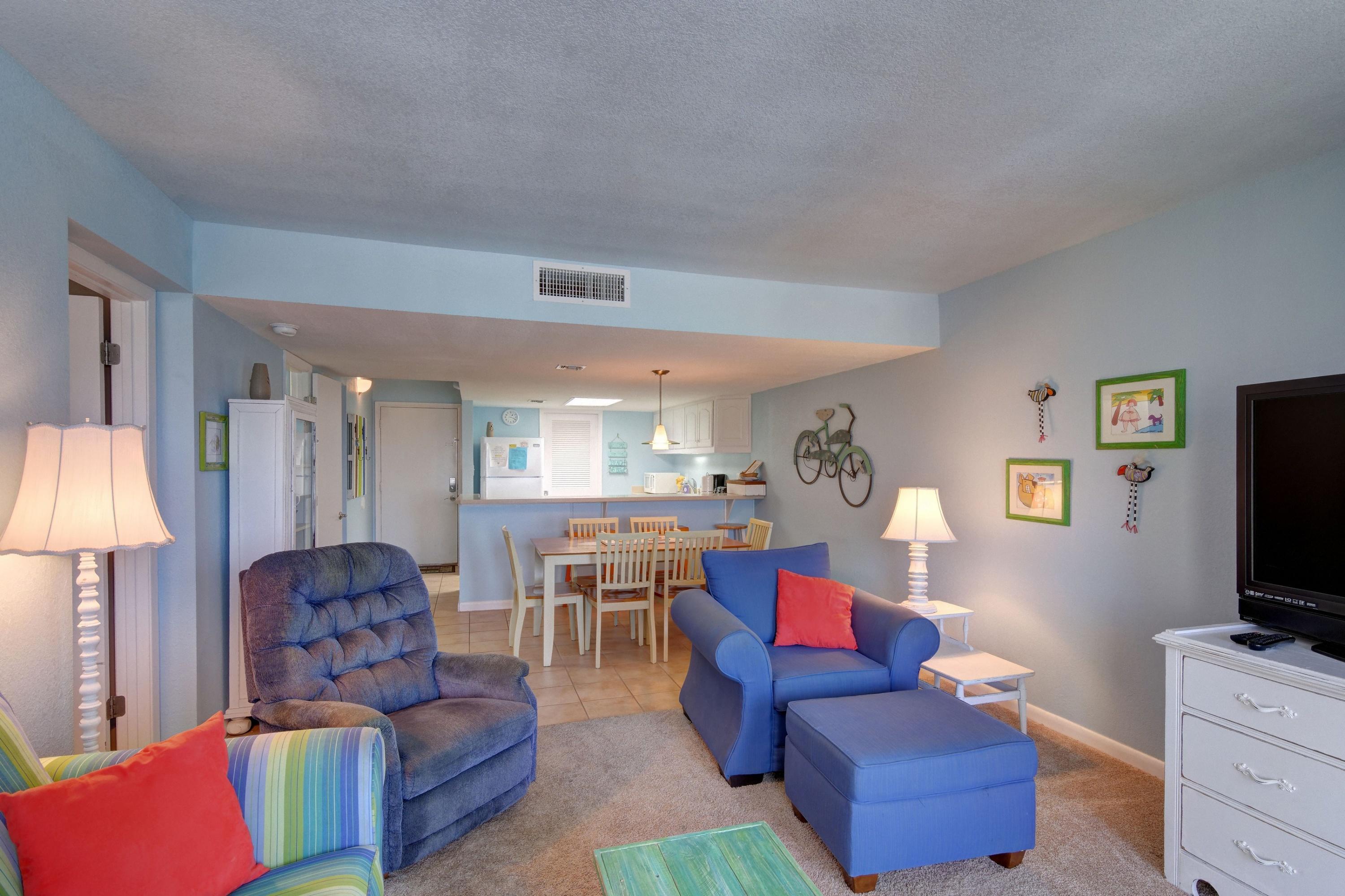 23223 Front Beach Road, Unit 701 Panama City Beach, FL 32413 - Photo 10 of 42 a living room with furniture and a flat screen tv