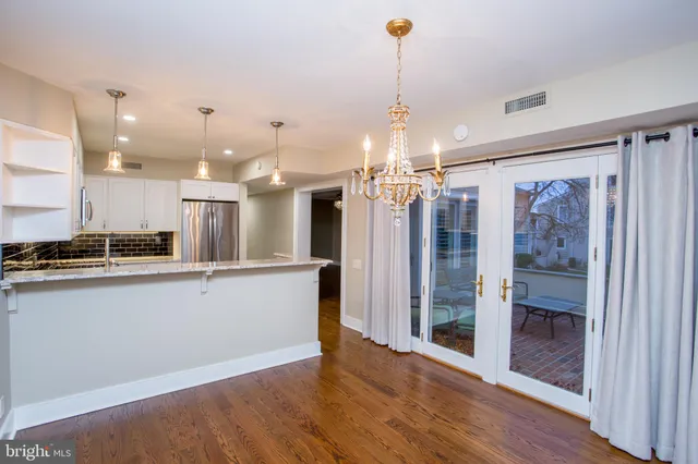 a dining room with a table and chairs