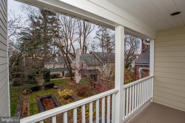 an empty room with windows and entrance