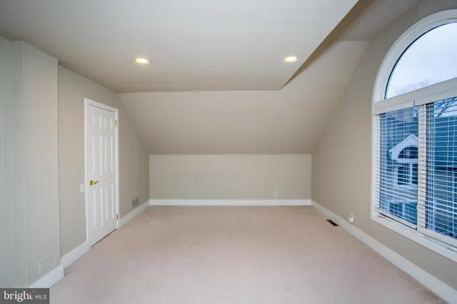 a view of a room with an empty space and a fire pit