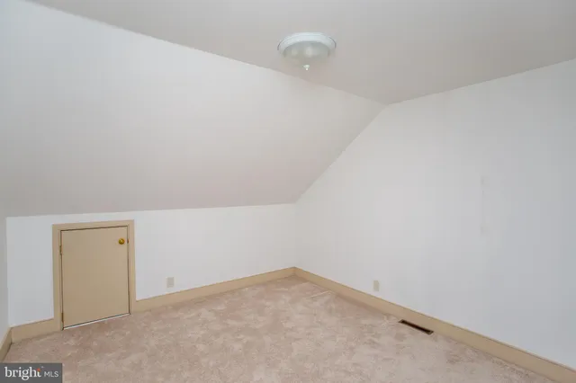 a view of walk in closet with clothes