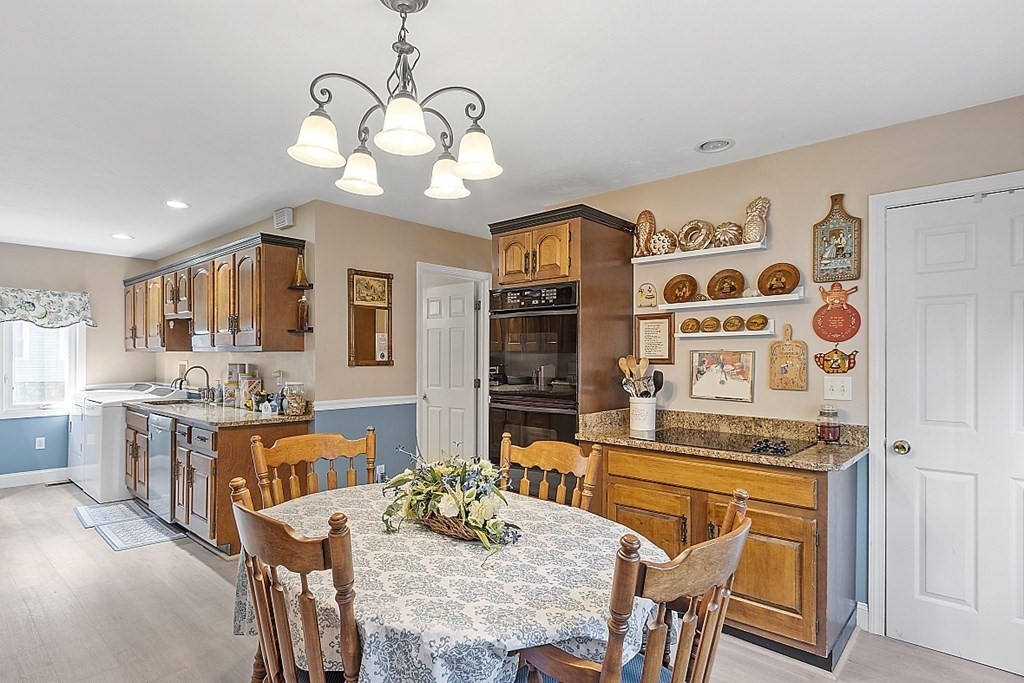 57 Vale Street Worcester, MA 01604 - Photo 11 of 39 a view of a dining room with furniture and wooden floor