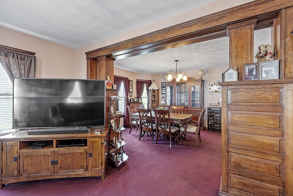 57 Vale Street Worcester, MA 01604 - Photo 14 of 39 a view of a livingroom with furniture and a flat screen tv