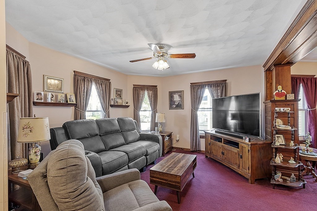 57 Vale Street Worcester, MA 01604 - Photo 16 of 39 a living room with furniture and a flat screen tv