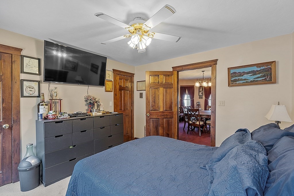 57 Vale Street Worcester, MA 01604 - Photo 19 of 39 a bed room with a bed and a television