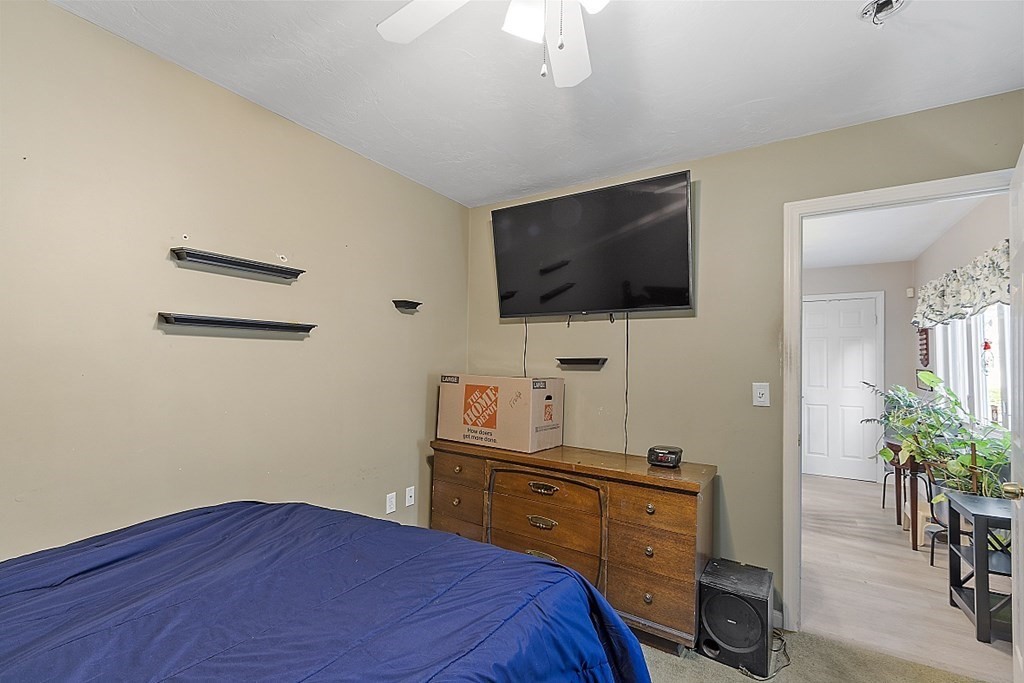 57 Vale Street Worcester, MA 01604 - Photo 20 of 39 a bedroom with a bed and a flat screen tv