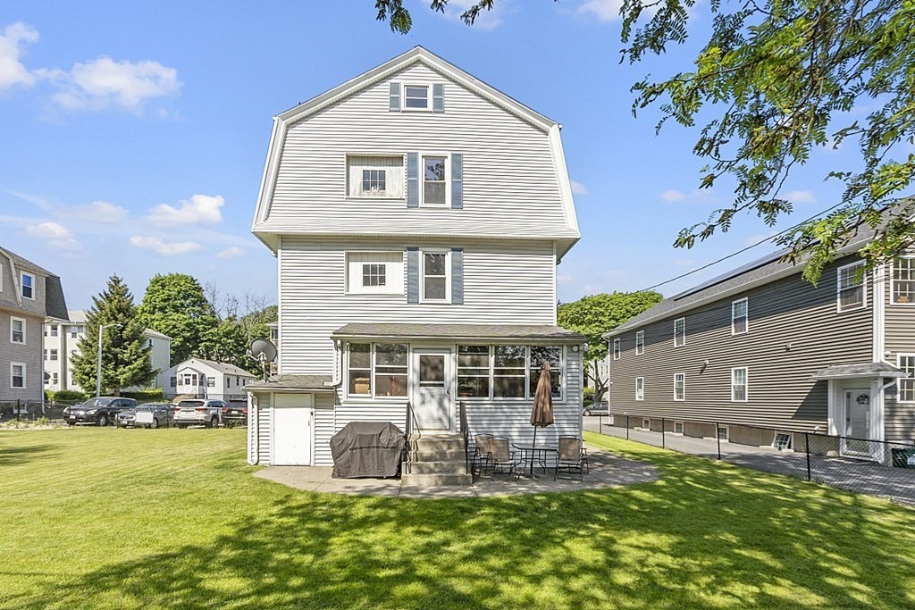 57 Vale Street Worcester, MA 01604 - Photo 2 of 39 a front view of a house with a yard