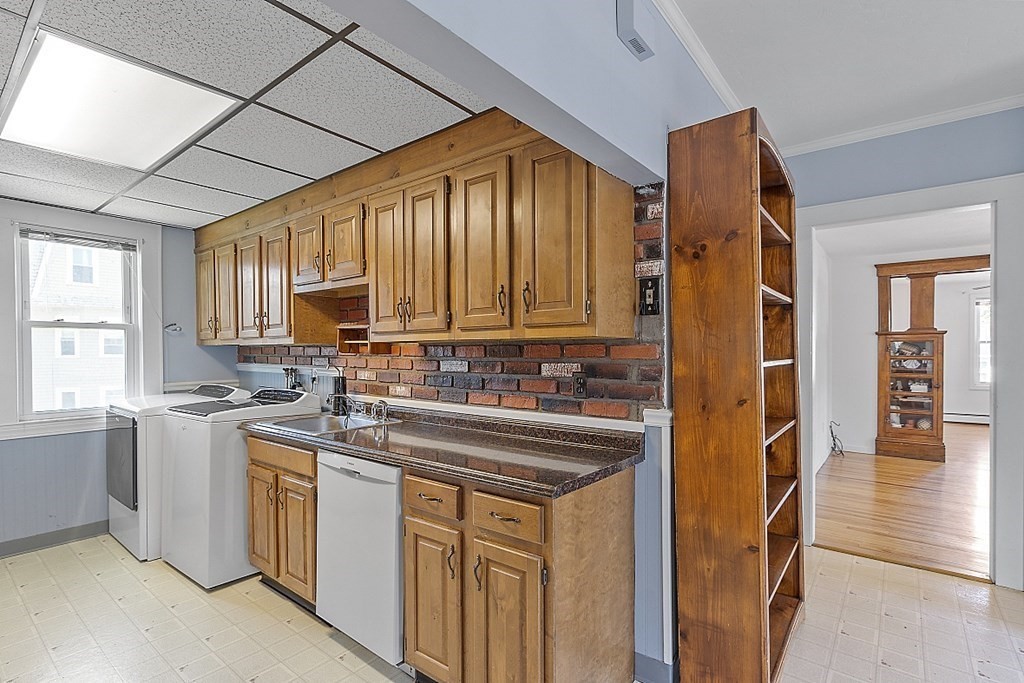 57 Vale Street Worcester, MA 01604 - Photo 27 of 39 a kitchen that has a sink and cabinets
