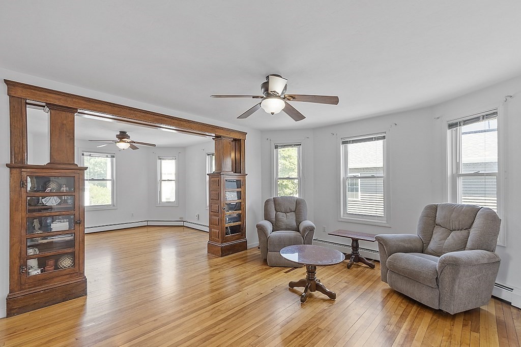 57 Vale Street Worcester, MA 01604 - Photo 30 of 39 a living room with furniture or window and a wooden floor