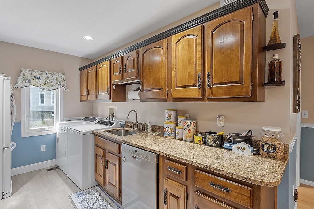 57 Vale Street Worcester, MA 01604 - Photo 3 of 39 a kitchen with stainless steel appliances granite countertop a sink stove and cabinets