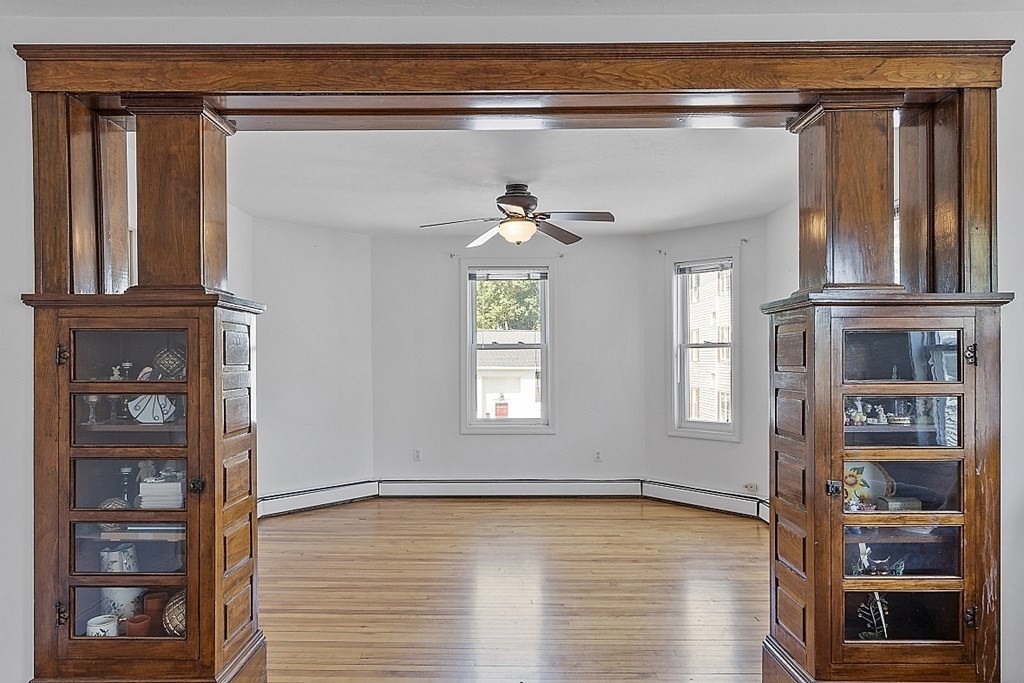 57 Vale Street Worcester, MA 01604 - Photo 32 of 39 a view of an empty room with cabinet and a window