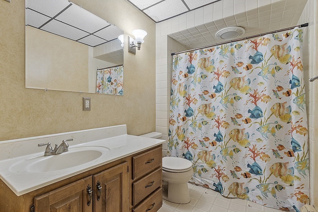 57 Vale Street Worcester, MA 01604 - Photo 33 of 39 a bathroom with a sink toilet and shower