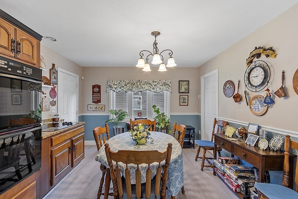 57 Vale Street Worcester, MA 01604 - Photo 7 of 39 a large kitchen with a table and chairs