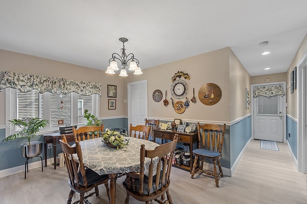 57 Vale Street Worcester, MA 01604 - Photo 9 of 39 a view of a dining room with furniture and chandelier