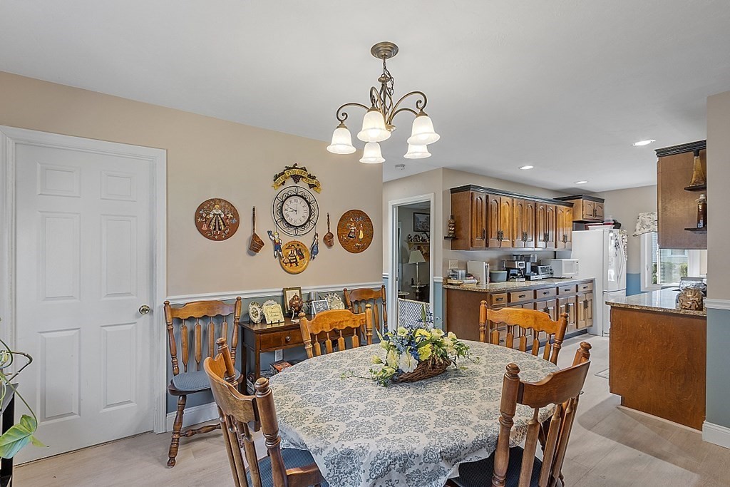 57 Vale Street Worcester, MA 01604 - Photo 10 of 39 a view of a dining room with furniture and a chandelier