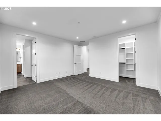 a bathroom with a bathtub shower sink mirror and toilet