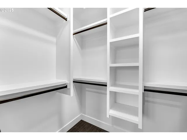 a spacious bathroom with a tub and a large mirror