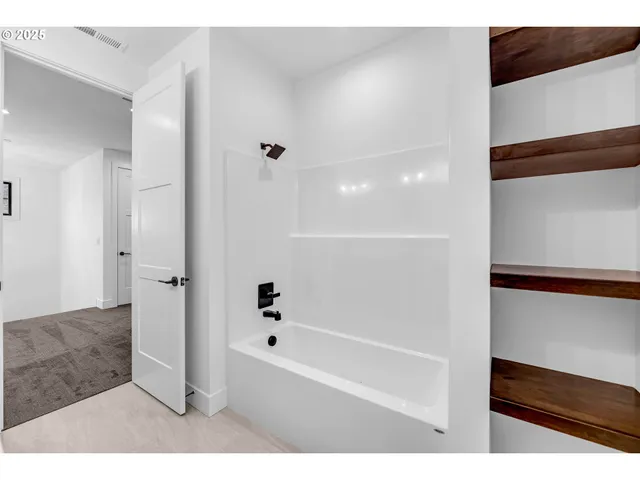 a bathroom with a sink and a large mirror