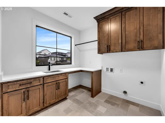 a view of a backyard with wooden fence