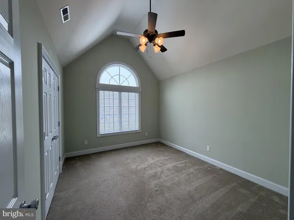 a view of empty room with windows