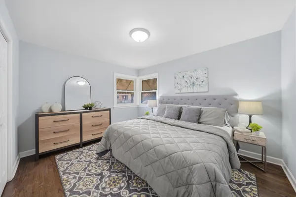 a bedroom with a bed and a dresser