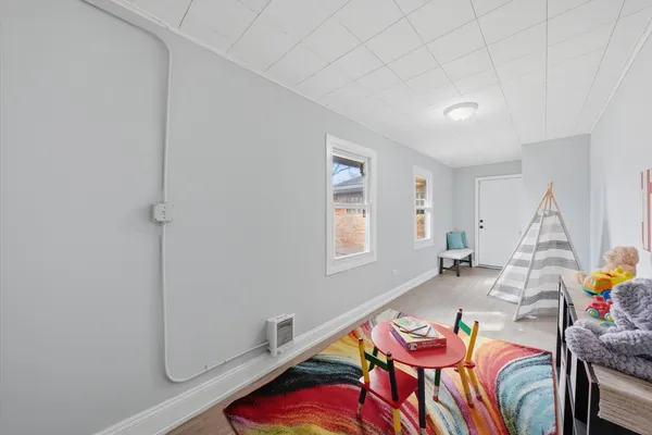 a bedroom with a bed and a table in it