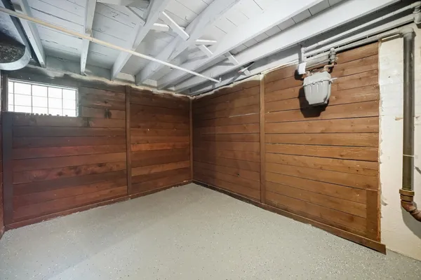 a view of a room with wooden walls
