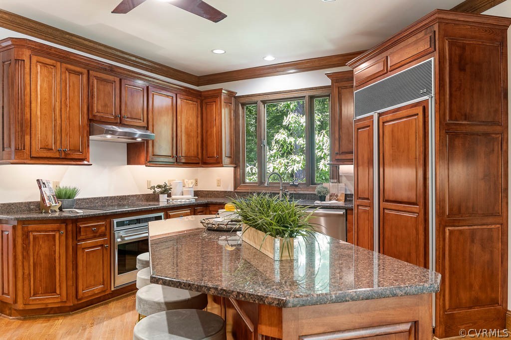 4110 Reeds Landing Circle Midlothian, VA 23113 - Photo 18 of 50 a kitchen with stainless steel appliances granite countertop a sink a stove and a refrigerator