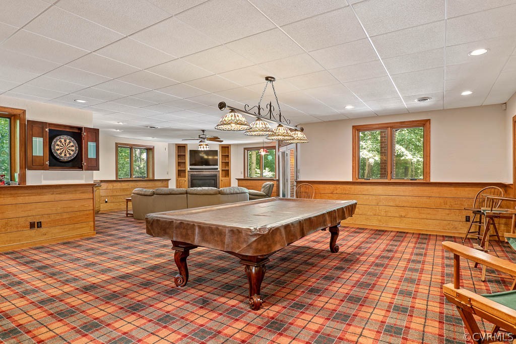 4110 Reeds Landing Circle Midlothian, VA 23113 - Photo 40 of 50 a living room with a table tennis table and paintings on the wall