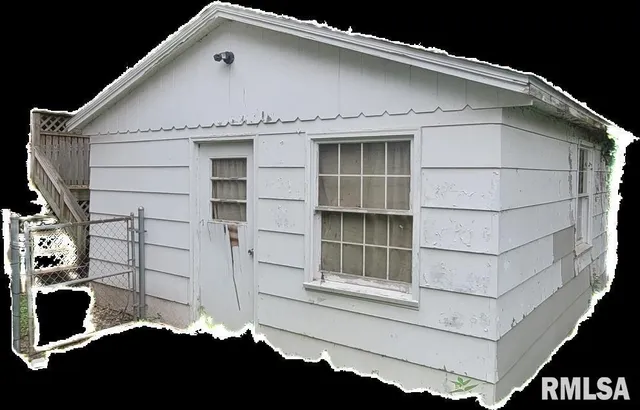 a front view of a house with a large window